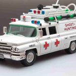 A realistic, high definition image of a newly revealed model of a ghost-hunting vehicle by a popular toy manufacturing company. The model represents a retrofitted ambulance, painted in white and adorned with various ghost-catching equipment. It doesn't bear any direct resemblance or any clear connections to known copyrighted characters, logos, or emblems.